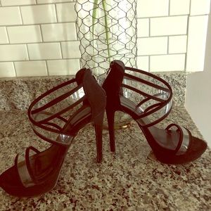 Black strapped heels with clear accents.